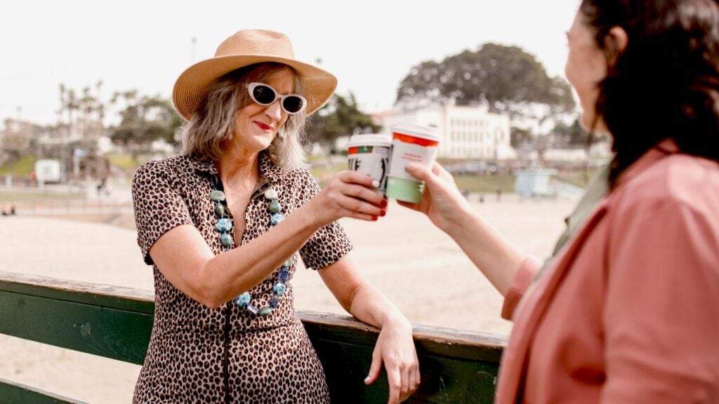 Friends enjoying coffee at the beach