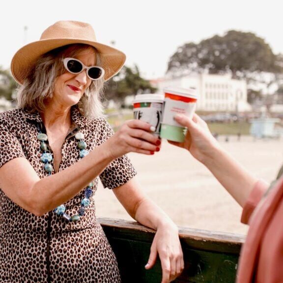 Friends enjoying coffee at the beach